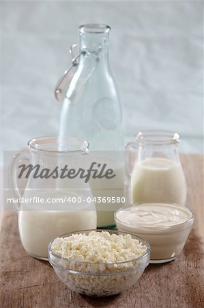 various types of fresh milk products on old wooden table