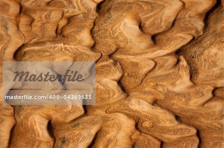Beautiful rippled wet sand background or texture