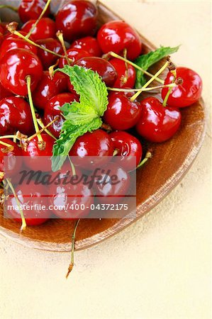 fresh organic ripe black cherry with mint leaf