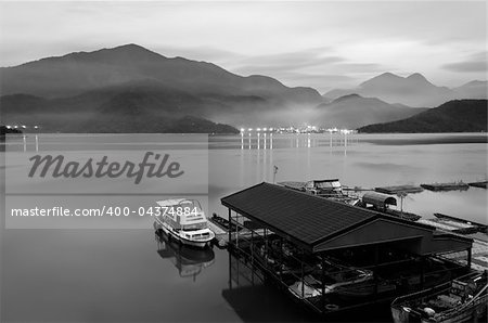 Morning lake and dock, Taiwan famous attraction, Sun Moon Lake situated in Yuchi, Nantou, Taiwan, Asia. Landscape in black and white tone.
