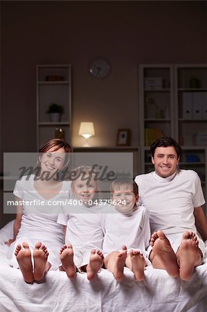 A happy family evening in the bedroom