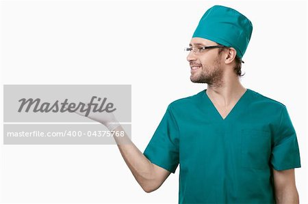 Smiling surgeon shows his hand