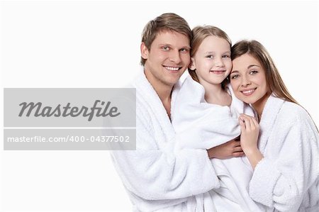 Happy family in the robes on a white background