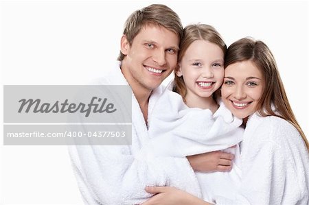 Family with a child in overalls on a white background