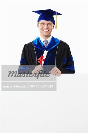 Young student with a diploma with an empty billboard on a white background