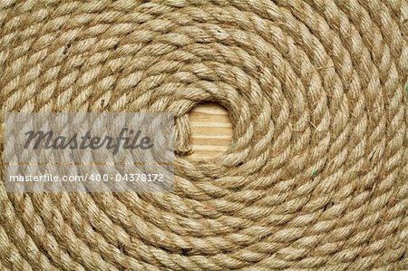 Roll of old rough rope, background