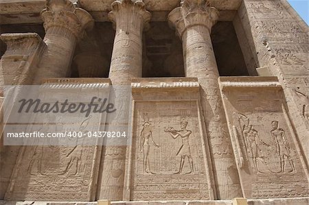 Egyptian hieroglyphic carvings on a wall at the Temple of Edfu