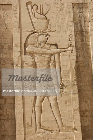 Egyptian hieroglyphic carvings on a wall at the Temple of Edfu