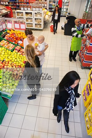 High angle view of people buying in supermarket