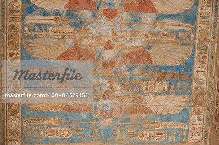 Egyptian hieroglyphic carvings on a wall at the Temple of Medinat Habu