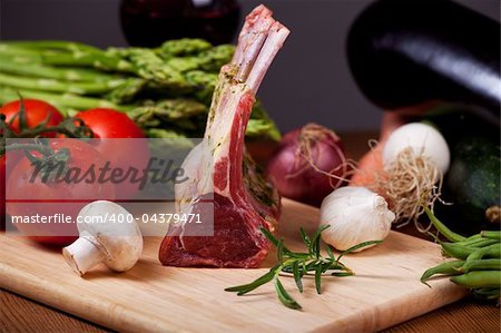 raw lamb meat and assorted vegetables