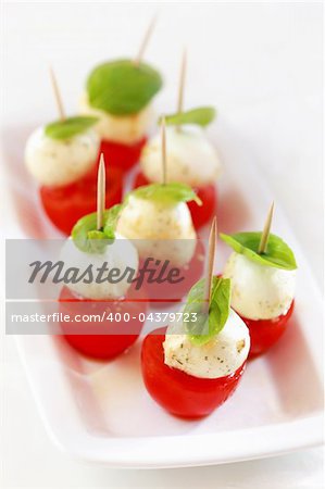 Appetizer with marinated mozzarella and snack tomatoes