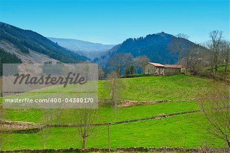 Field on the Slopes of The Pyrenees With Old Farmhouse