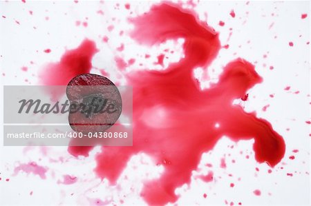 image of fresh cherry cut in halves with  cherry juice on white