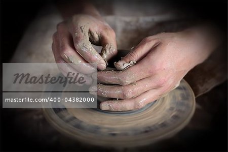 Hands of a potter. Loyalty to the traditions concept