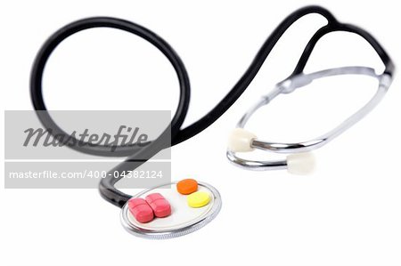 medical concept with colorful pills and stethoscope on white