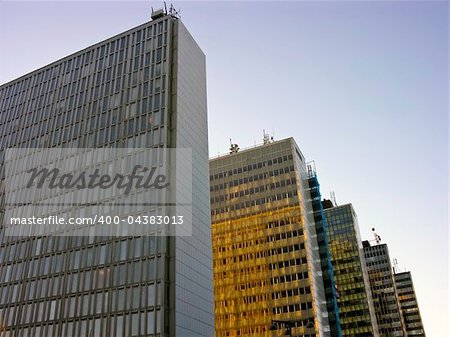 Blue and yellow skyscrapers in a row