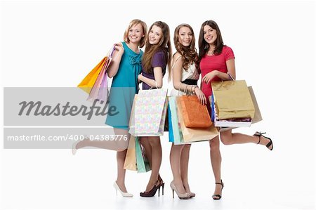 Cute young girls with their bags on a white background