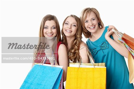 Smiling girl with shopping bags on white background