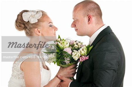 groom and bride are holding bridal bouquet, cut out from white