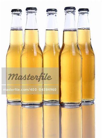 Bottles of cold and fresh beer over white background