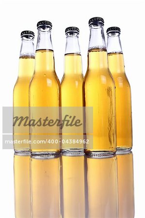 Bottles of cold and fresh beer with reflection on table
