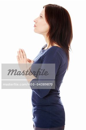 Middle aged woman praying , isolated on white