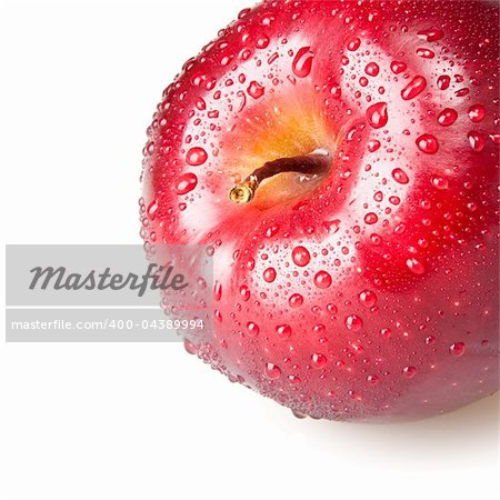 wet red apple isolated on white