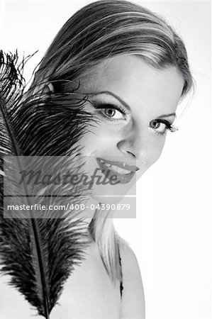 b/w Portrait of sexy fashion woman with red lips in black dress with bird feather. white background