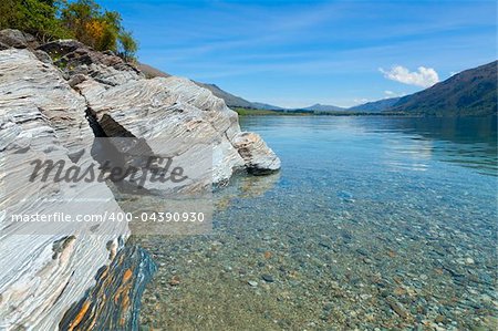 View of the clear waters and mountains at lake Wakatipu, New Zealand