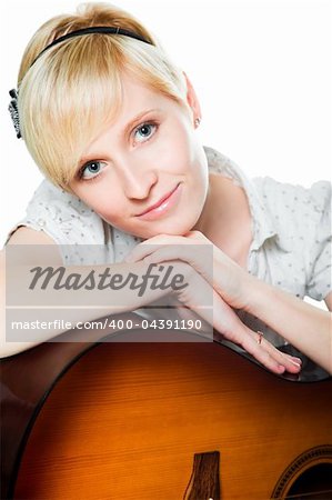 Portrait of attractive young blond woman with guitar on isolated white background