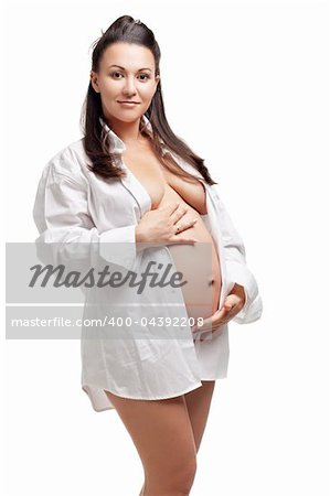 Beautiful young pregnant woman, isolated on white