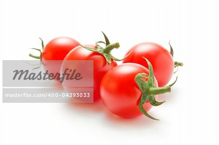 Fresh ripe cherry tomatoes closeup  isolated on white background