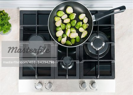 vegetables dish prepared in a black skillet in the kitchen