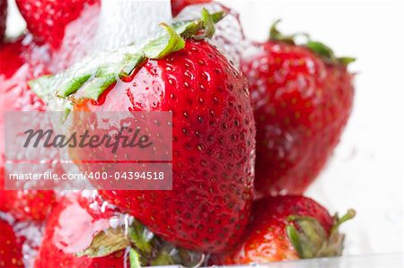 Fresh red strawberries being washed