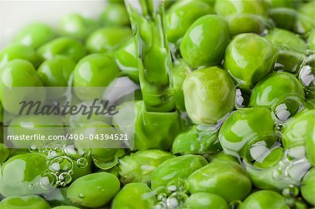Fresh green peas being washed