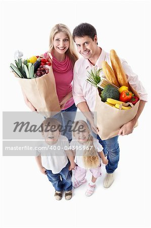 A happy family with their purchases on a white background