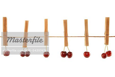 Sweet red cherries and clothes line isolated on a white background