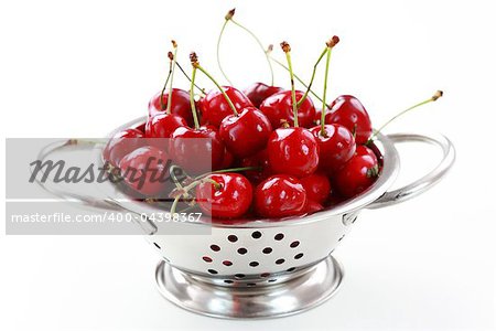 Fresh cherries in the bowl on white background