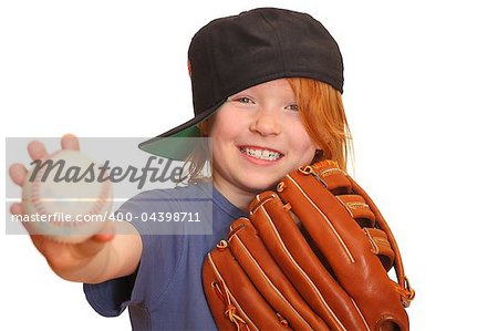 Portrait of a smiling red haired giirl with baseball cap glove and ball