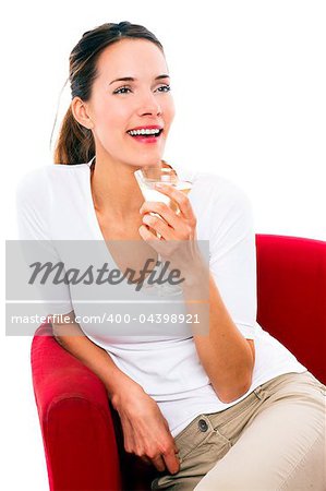 Young woman drinking a cocktail on white background studio