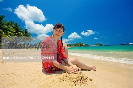 beautiful girl enjoying the sandy beach on sunny day