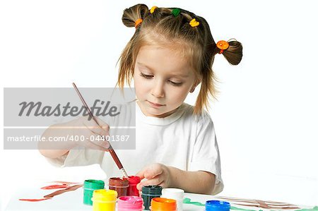 cute little girl with a brush and paints