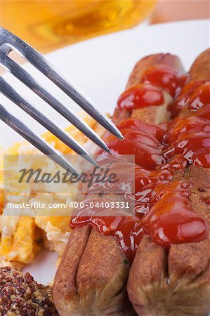 grilled hot dog with ketchup sauce and mustard