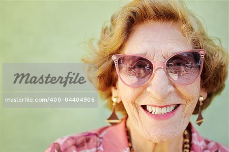 portrait of happy senior caucasian woman looking at camera and smiling. Horizontal shape, copy space