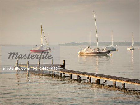 An image of some boats in the early morning mood