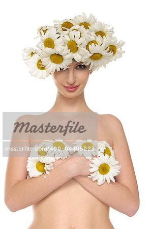 Sexy woman is covered daisies isolated on white