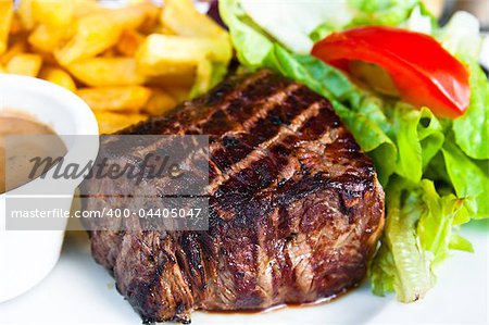 juicy steak beef meat with tomato and potatoes