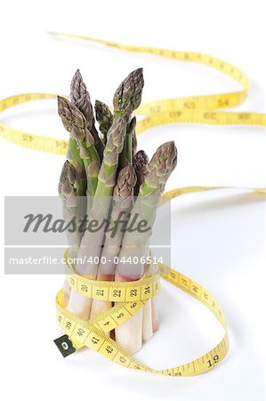 Raw asparagus and measuring type isolated on a white background