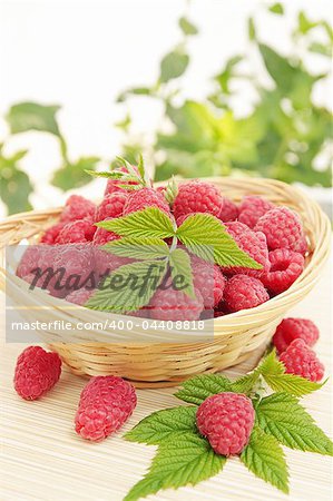 Fresh ripe juicy raspberries in the basket